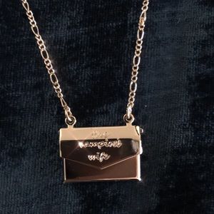 The Vampire’s Wife gold envelope necklace